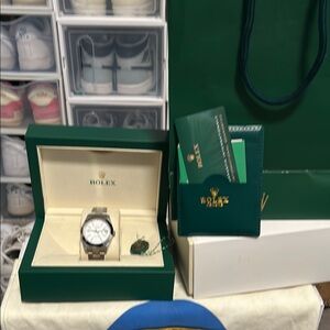 Rolex Silver Watch with White Dial